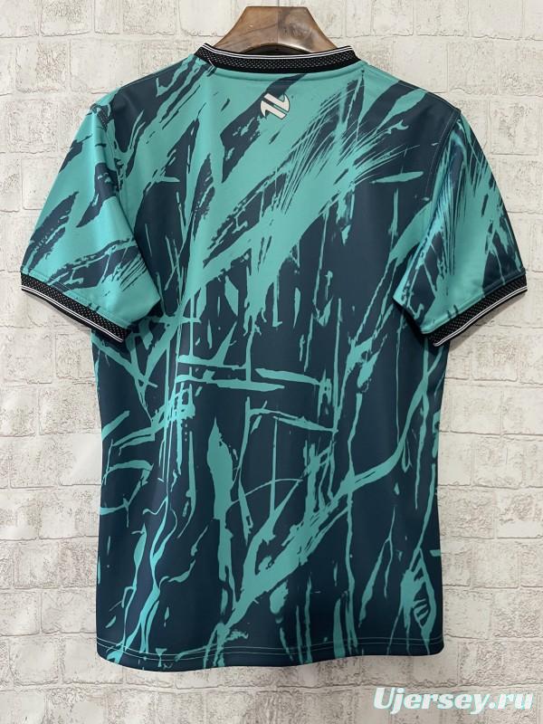 25/26 Tipperary GAA Teal with Warrior Silhouette and Abstract Brushstroke Pattern Jersey